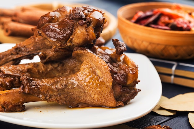 Roasted duck wing root on a white plate