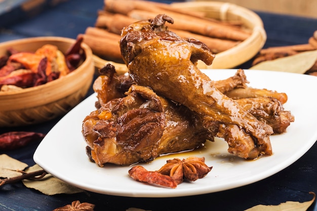 Roasted duck wing root on a white plate