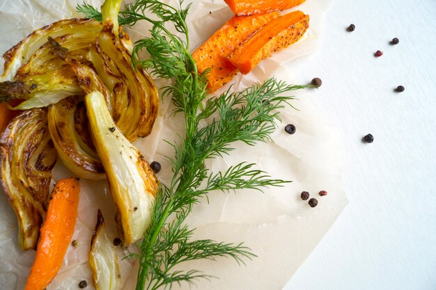 Roasted fennel with carrots. Sliced fennel oven roasted in olive oil.