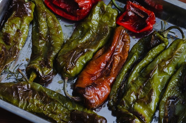 Roasted green and red peppers on a tray