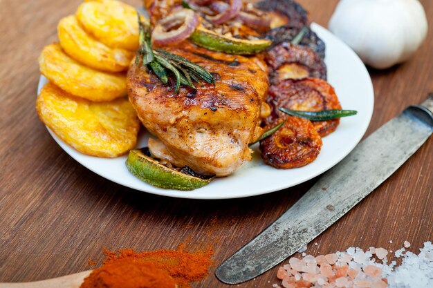 Roasted grilled BBQ chicken breast with herbs and spices