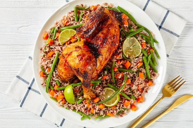 Roasted Half Chicken with brown rice on a platter