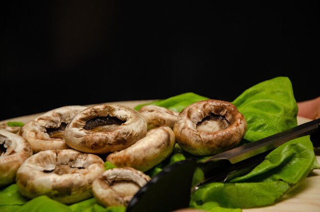 Roasted mushrooms served on a green salad