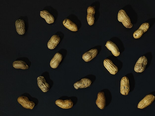 Roasted peanuts on a black background