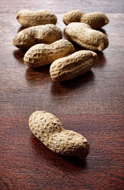 Roasted peanuts on a wooden table