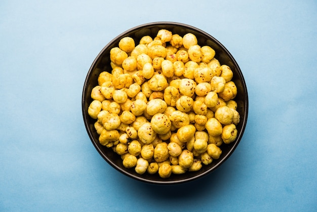 Roasted Phool Makhana or Crispy Lotus pops Seed served in a bowl, selective focus