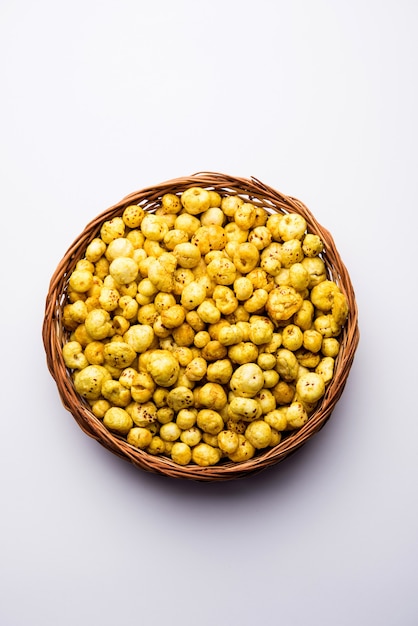 Roasted Phool Makhana or Crispy Lotus pops Seed served in a bowl, selective focus