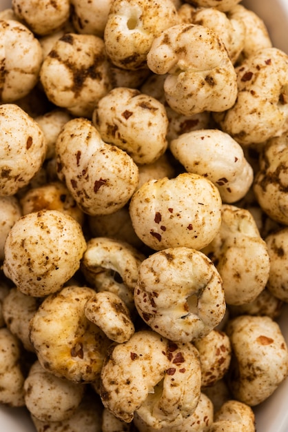 Roasted Phool Makhana or Crispy Masala  Lotus pops Seed served in a bowl, selective focus