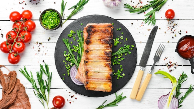 Roasted pork ribs with rosemary and spices Top view Free space for your text