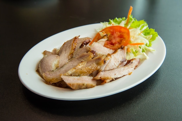 Roasted pork on the table in the restaurant.