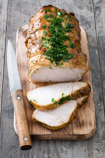 Roasted pork on wooden table