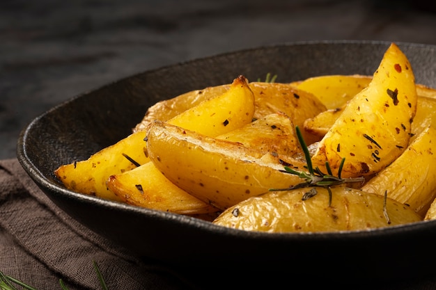 Roasted potatoes with rosemary on the plate