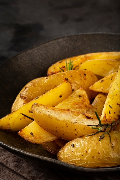 Roasted potatoes with rosemary on the plate