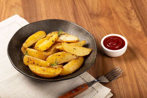 Roasted potatoes with rosemary on the plate