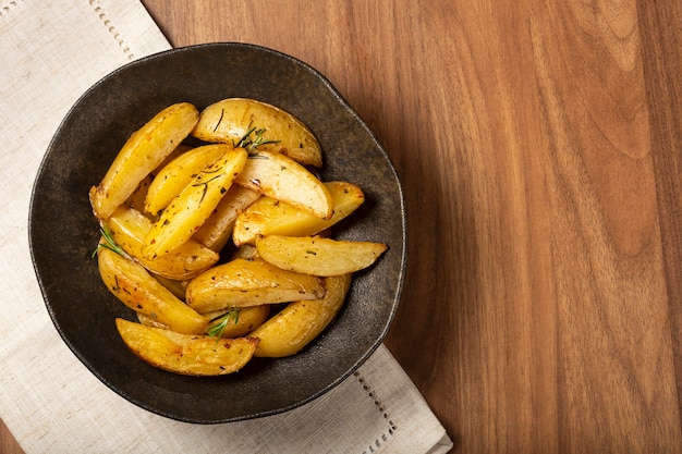 Roasted potatoes with rosemary on the plate