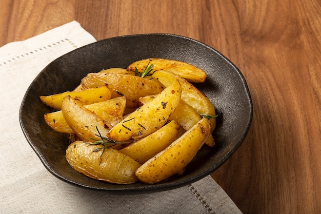 Roasted potatoes with rosemary on the plate