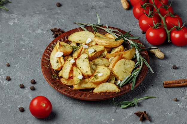 Roasted rosemary garlic potato wedges on a plate