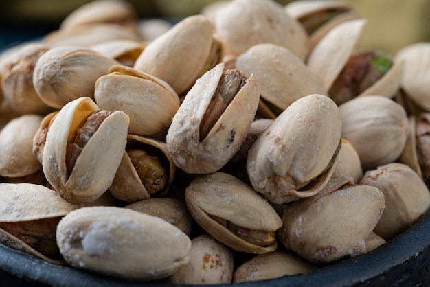 Roasted And Salted Pistachios In Ceramic Bowl