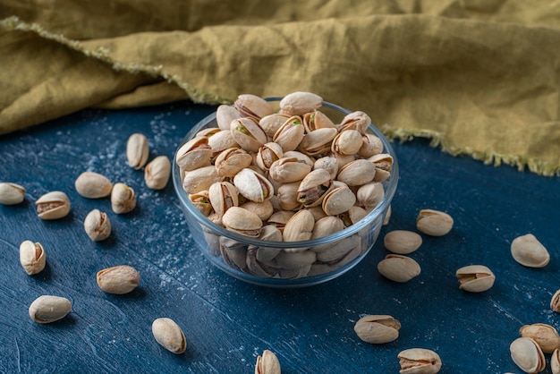 Roasted And Salted Pistachios In Glass Bowl