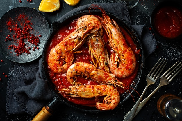 Roasted shrimps on pan on table