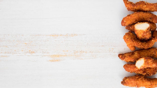 Roasted sliced chicken meat placed in row