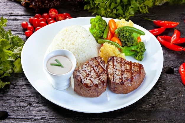 Roasted steak meat rice and vegetables