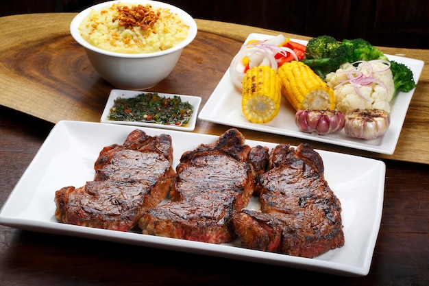 roasted steak with salad and potato