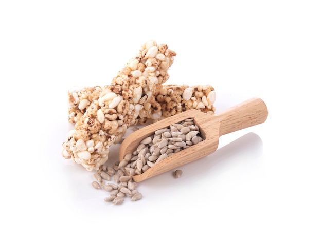 Roasted Sunflower Seeds in spoon on white background