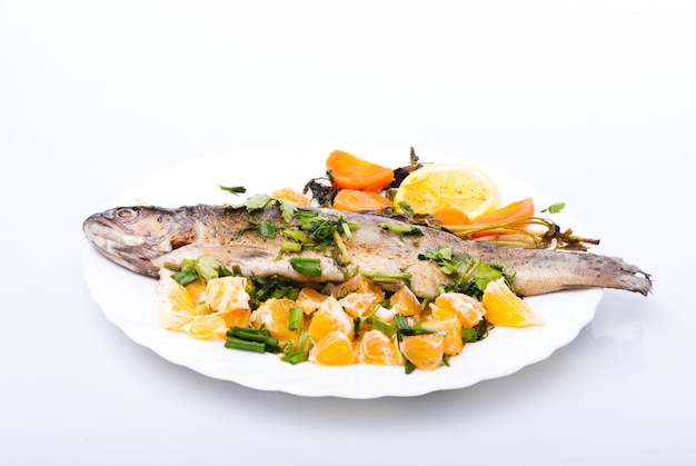 Roasted trout with vegetables and herbs