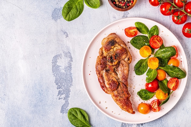 Roasted turkey steak with salad