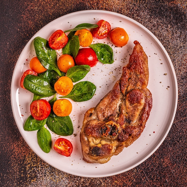 Roasted turkey steak with salad