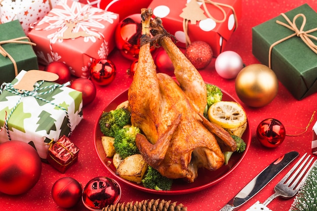 Roasted whole chicken with Christmas decoration.