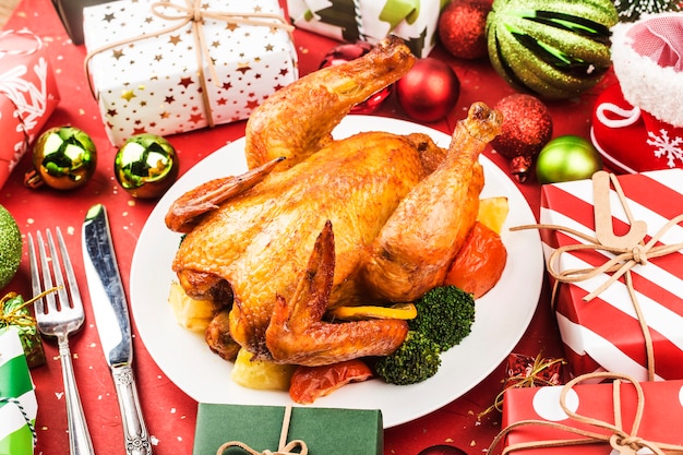 Roasted whole chicken with Christmas decoration.