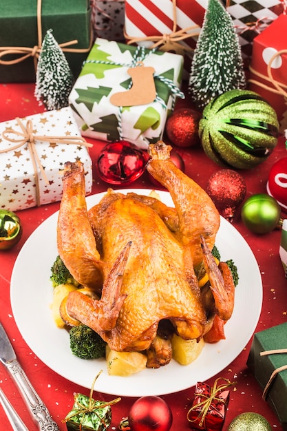 Roasted whole chicken with Christmas decoration.