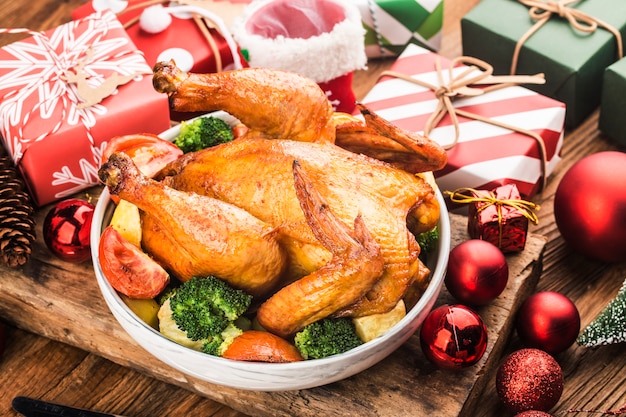 Roasted whole chicken with Christmas decoration.