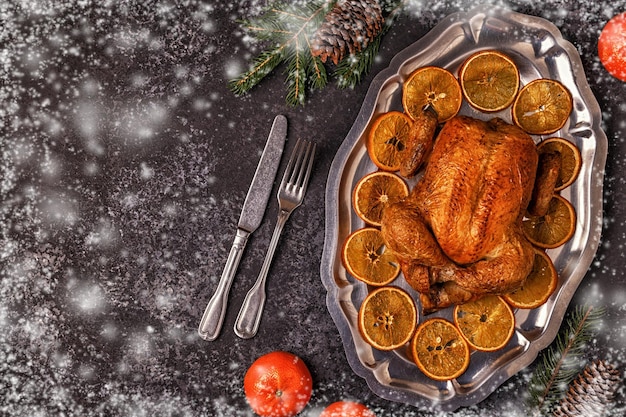 Roasted whole chicken with Christmas decoration