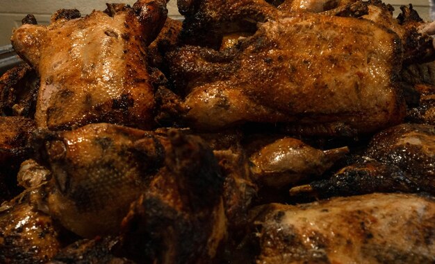 Roasted whole chickens selective focus close up