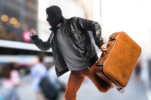 Robber running fast on unfocused background