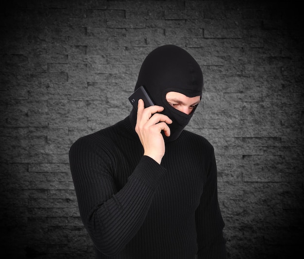 Robber talking on phone