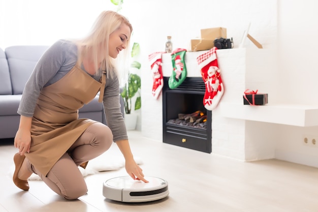 robot vacuum cleaner cleans christmas background smart home