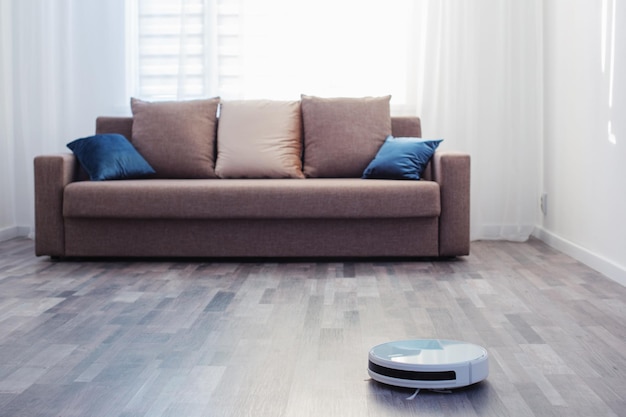 robot vacuum cleaner on the floor in living room