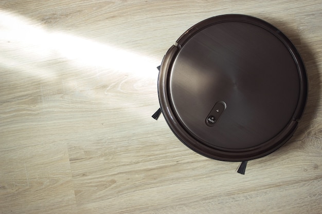 Photo robot vacuum cleaner on the floor. smart home.