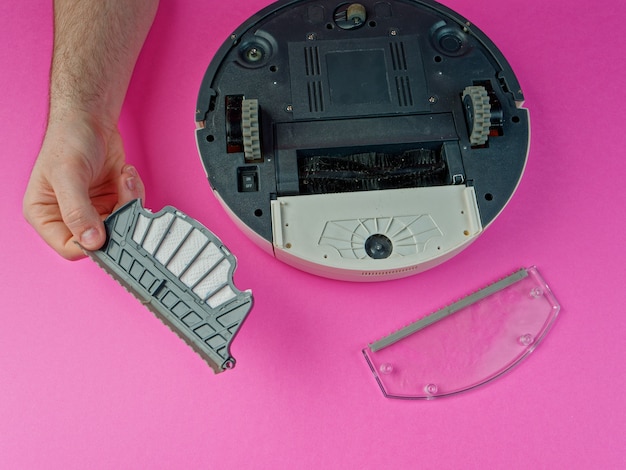 The robot vacuum cleaner is disassembled, the concept of repairing a robot vacuum cleaner