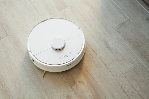 Robot vacuum cleaner performs automatic cleaning of the apartment at a certain time