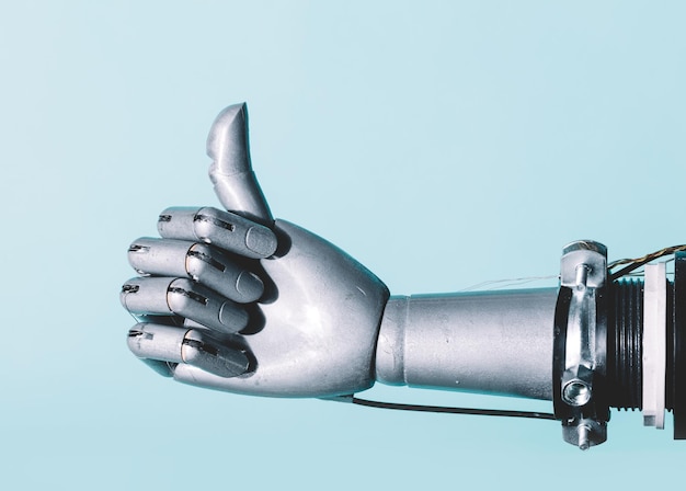 Robotic hand in retro future style in okay gesture on blue background