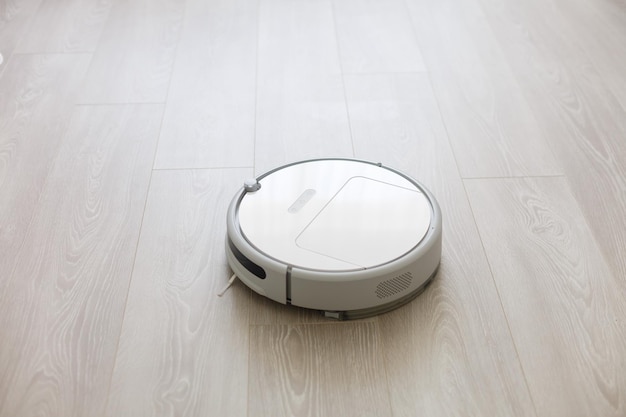 robotic vacuum cleaner on laminate wood floor smart cleaning technology