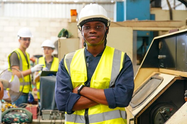 Robotics engineer working on maintenance of modern robotic arm in factory warehouse