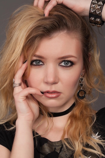 Rock baby. Fashion portrait of a young beautiful girl in the studio