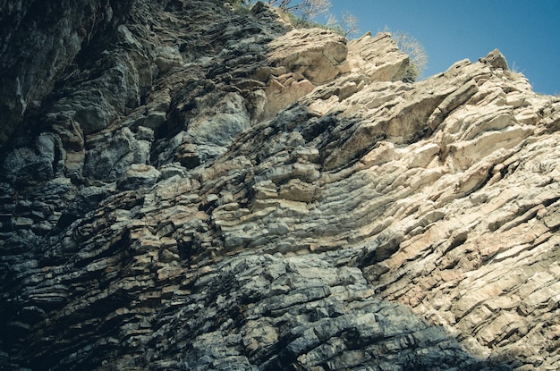 Rock the background of the layers of ancient sedimentsLayered stone