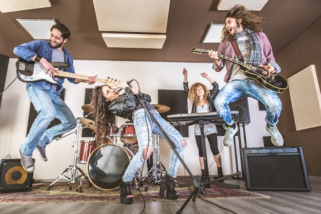 Rock band playing in a recording studio